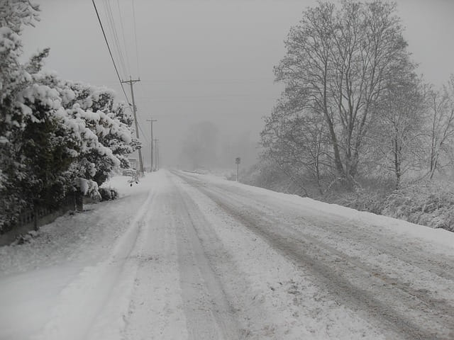 Empty snow-covered county road